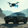 “A futuristic Toyota off-road SUV driving on a rocky mountain trail, with a small drone flying above the vehicle"