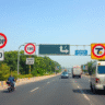 Indian road with various traffic signs visible.